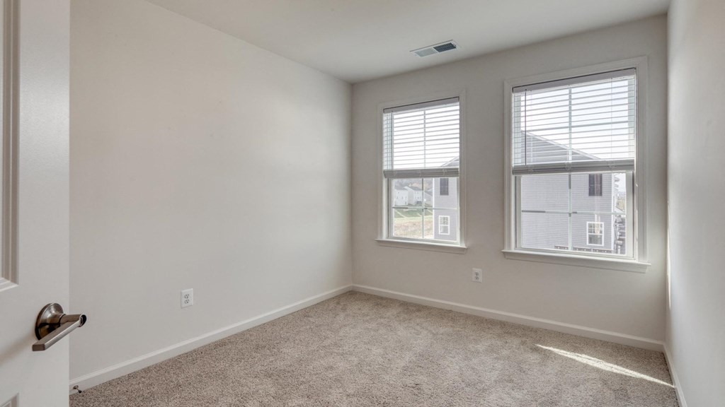 Carpeting In Bedrooms with wide windows at The Mark Townhomes Apartments, Harrisonburg