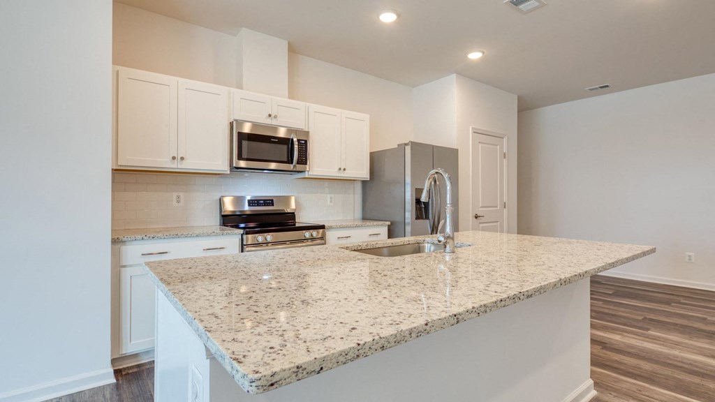 White Cabinetry And Appliances In Kitchen at The Mark Townhomes Apartments, Harrisonburg, VA, 22801