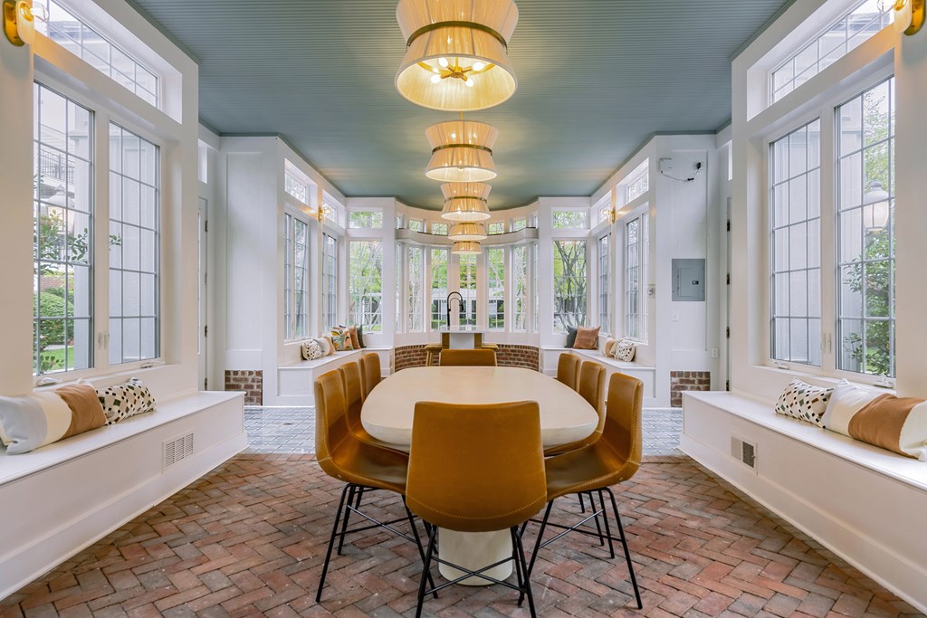 A dining room with a round table and chairs. at Times Square, Dublin, OH