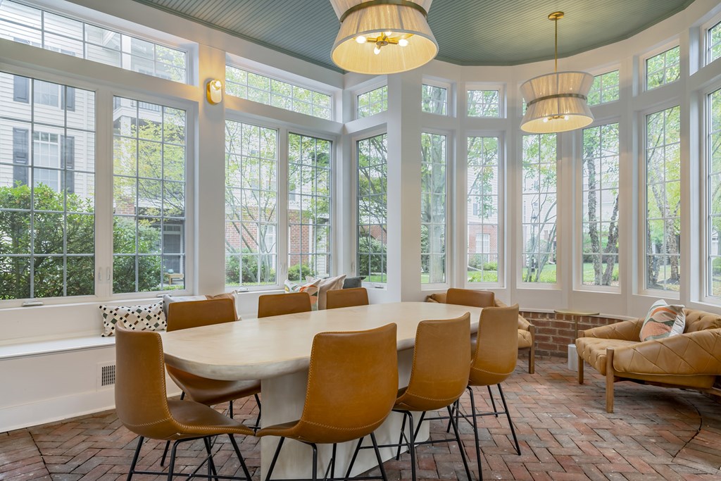 A dining room with a round table and chairs. at Times Square, Ohio