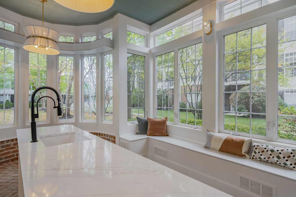 A kitchen with a large island and a window seat. at Times Square, Dublin, Ohio