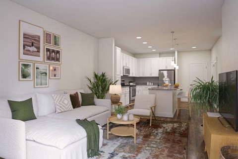 A living room with a white couch and a television.
