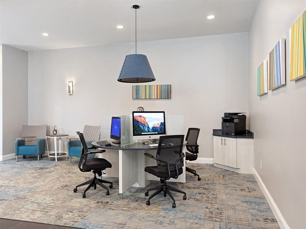 a room with a desk with two computers on itat Addison Crater Woods, Petersburg, 23805