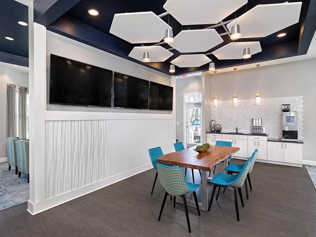 a conference room with a wooden table and blue chairsat Addison Crater Woods, Petersburg, VA