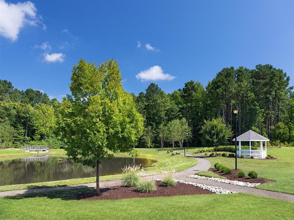 a park with a pond and gazeboat Addison Crater Woods, Virginia