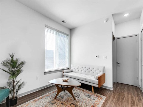 a living room with a couch and a table