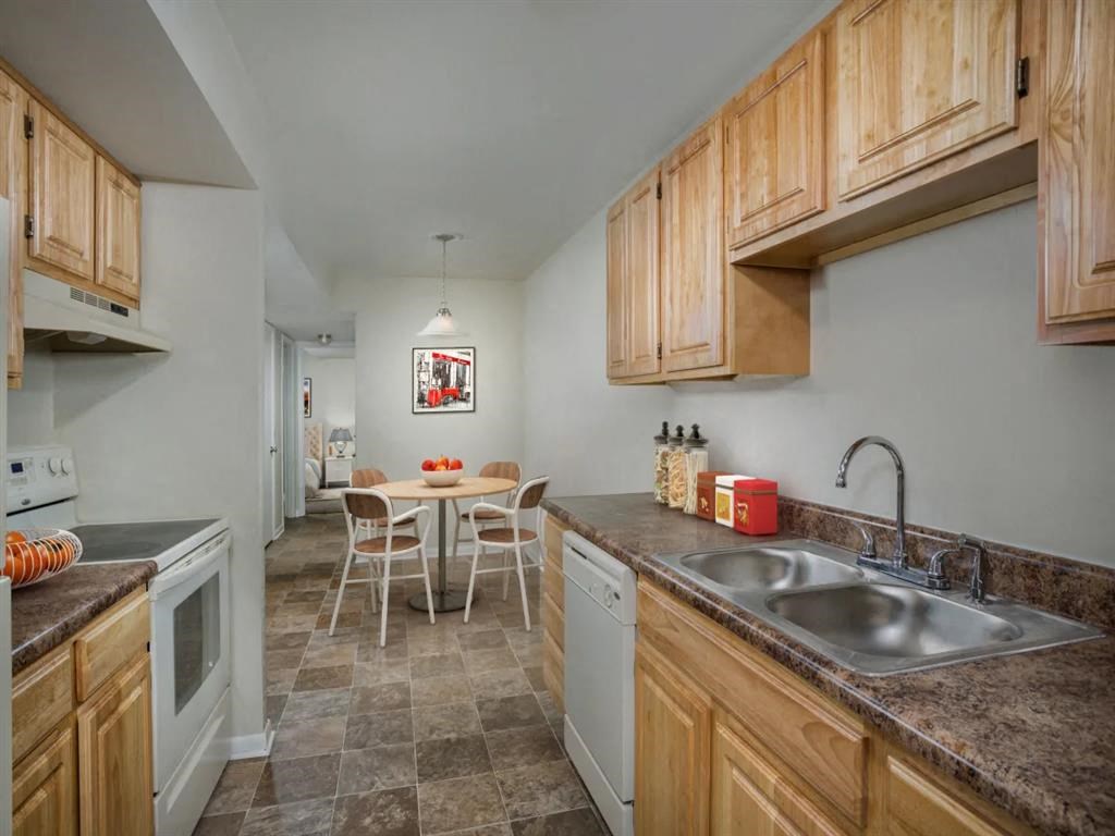 a kitchen with a sink and a table