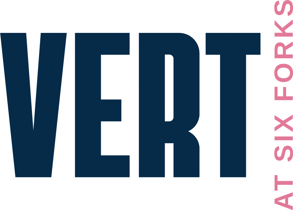 A graphic with the words "VERT" and "AT SIX FORKS" in blue and green respectively.