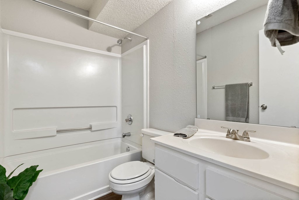 a white bathroom with a sink and a toile at Village 1373, Greensboro, NC