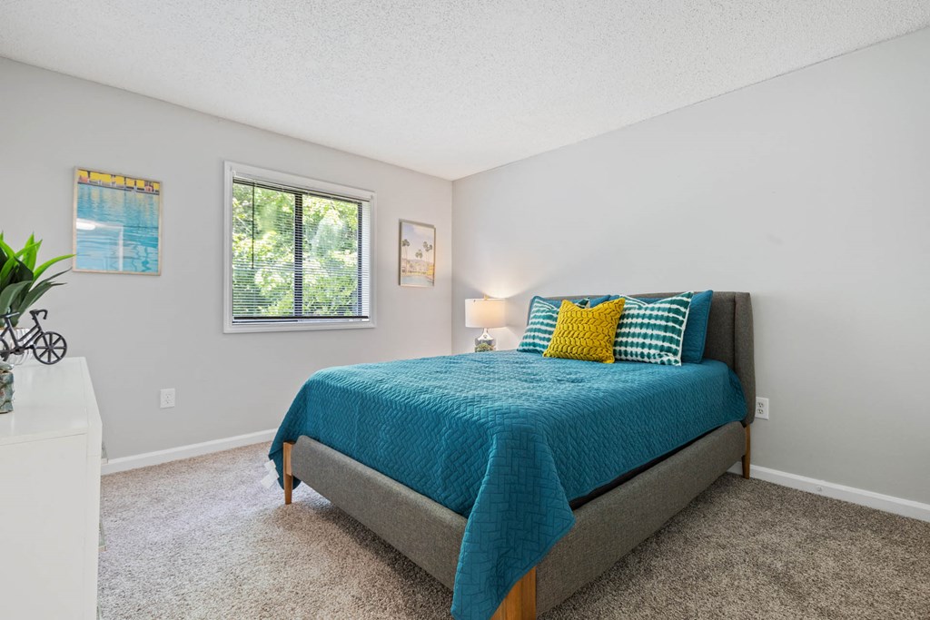 a bedroom with a bed and a window at Village 1373, North Carolina, 27455
