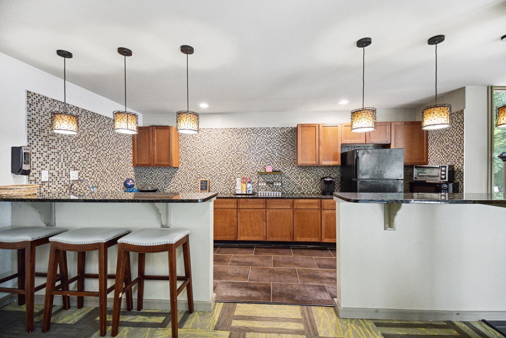a kitchen with a large island with stools