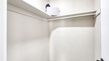 a small closet with a white wall and a shelf at Bayville Apartments, VA, 23455