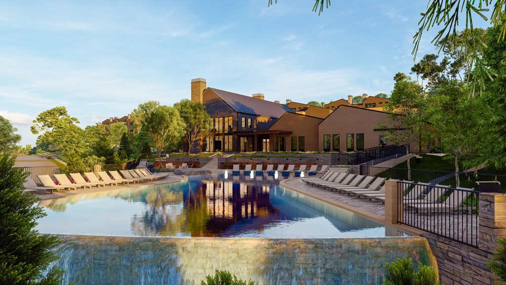 a swimming pool with chairs in front of a house at Terraces at High Mountain, Huntsville, 35811