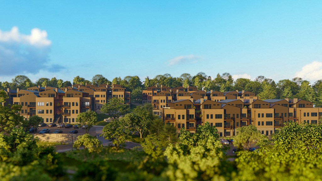 an aerial view of an apartment complex surrounded by trees at Terraces at High Mountain, Huntsville Alabama