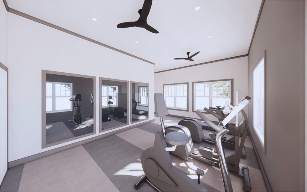 Gym with cardio equipment and a large window at The Mark Townhomes Apartments, Virginia