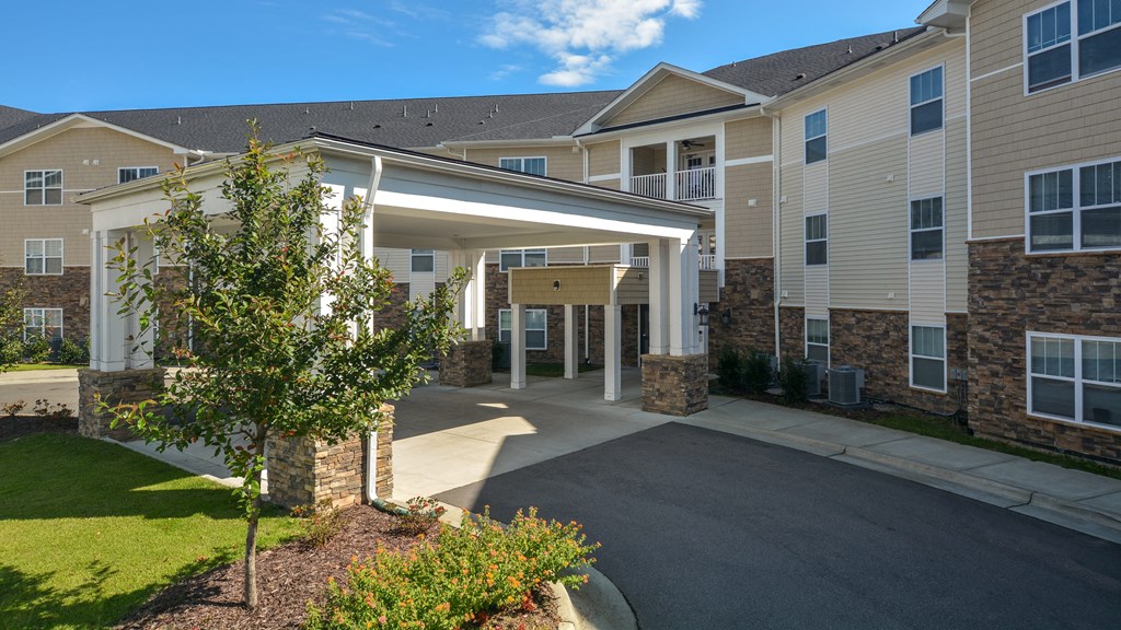 the view of the entrance to a building with a covered porch