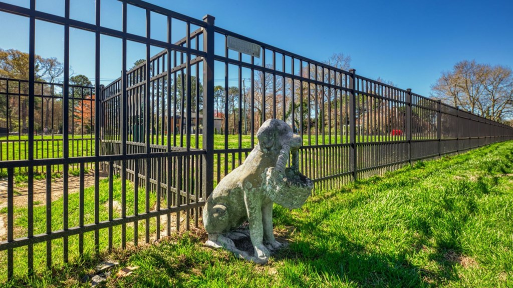 a statue of a statue in front of a fence  at Bayville Apartments, Virginia Beach, 23455