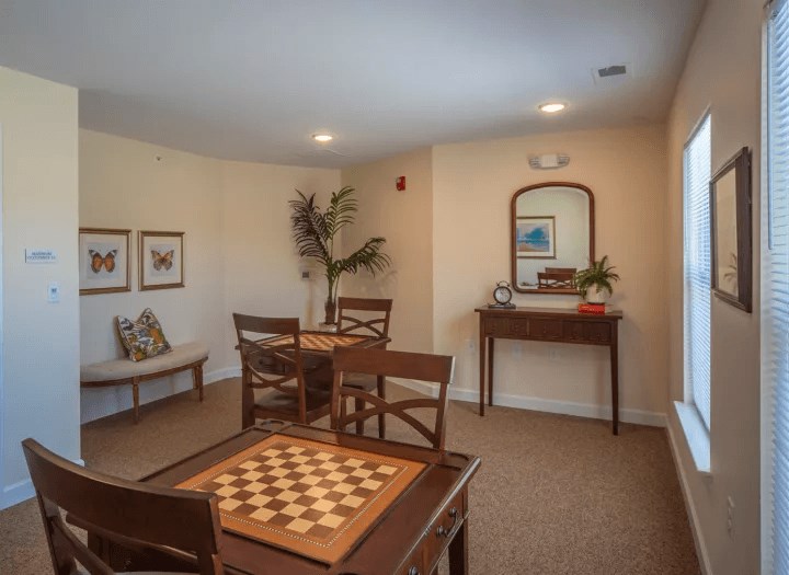a living room with a chess board on a table