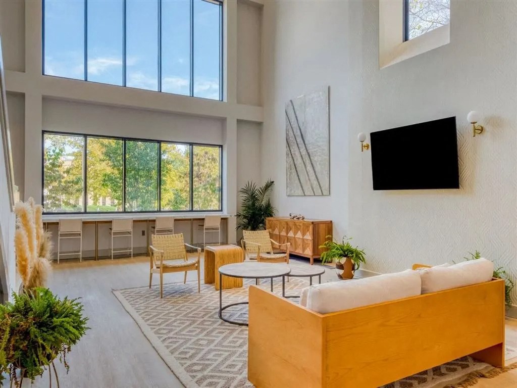 a living room with a couch and a table and a television