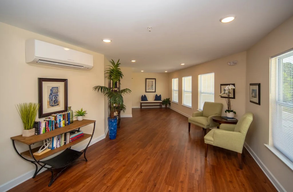 a living room with a hard wood floor and