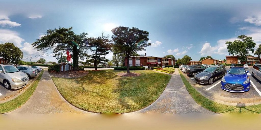 a group of cars parked in a parking lot at Gates of West Bay, Norfolk, VA 23503
