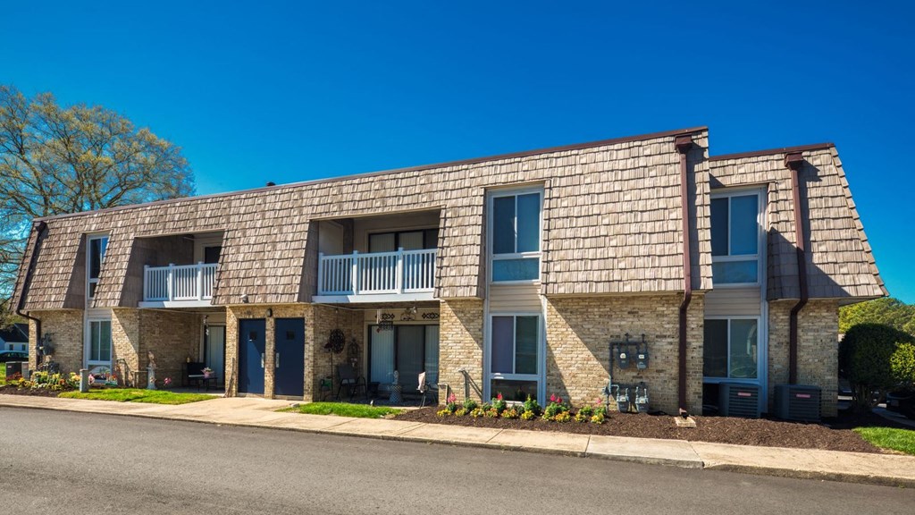 a building with a street in front of it  at Bayville Apartments, Virginia Beach, VA, 23455