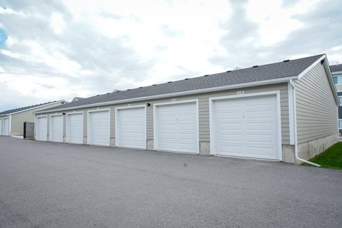 A long building with many garage doors.
