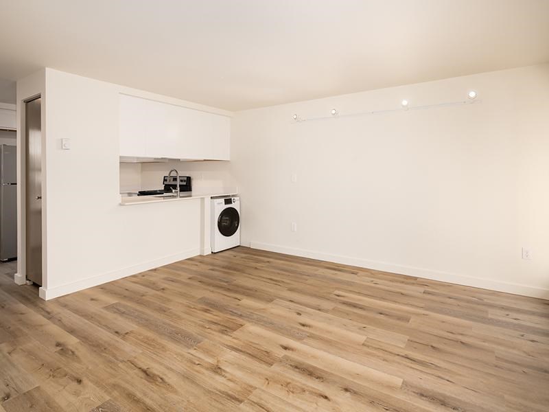 A room with a washer and dryer in it.