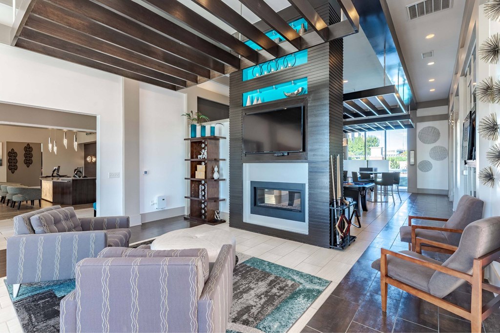 A modern living room with a fireplace and a television.