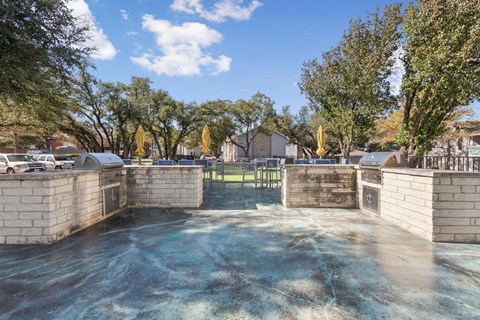 Empty concrete pool basin with brick pillars at Polo Club Apartments, Austin