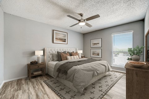 Bedroom with tufted headboard and contemporary decor at Peaks at Live Oak Apartments, San Antonio, TX 78233