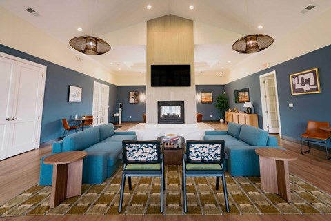 A living room with a fireplace and a television.