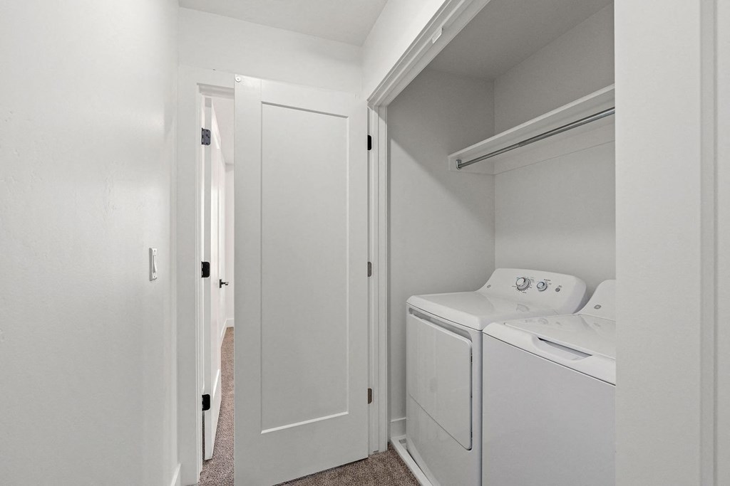 a laundry room with a washer and dryer