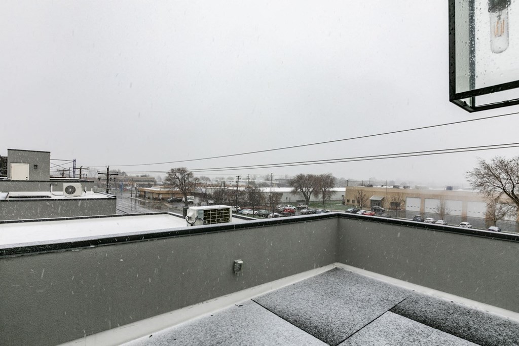 a balcony with a view of the city