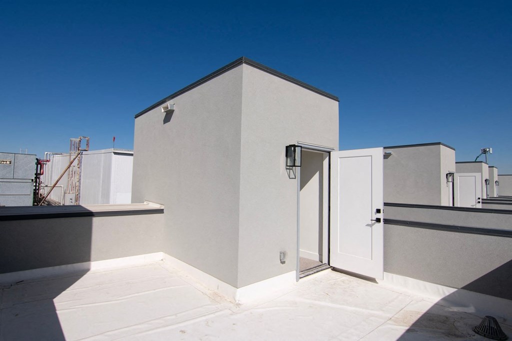 a view of the roof of a building with a door