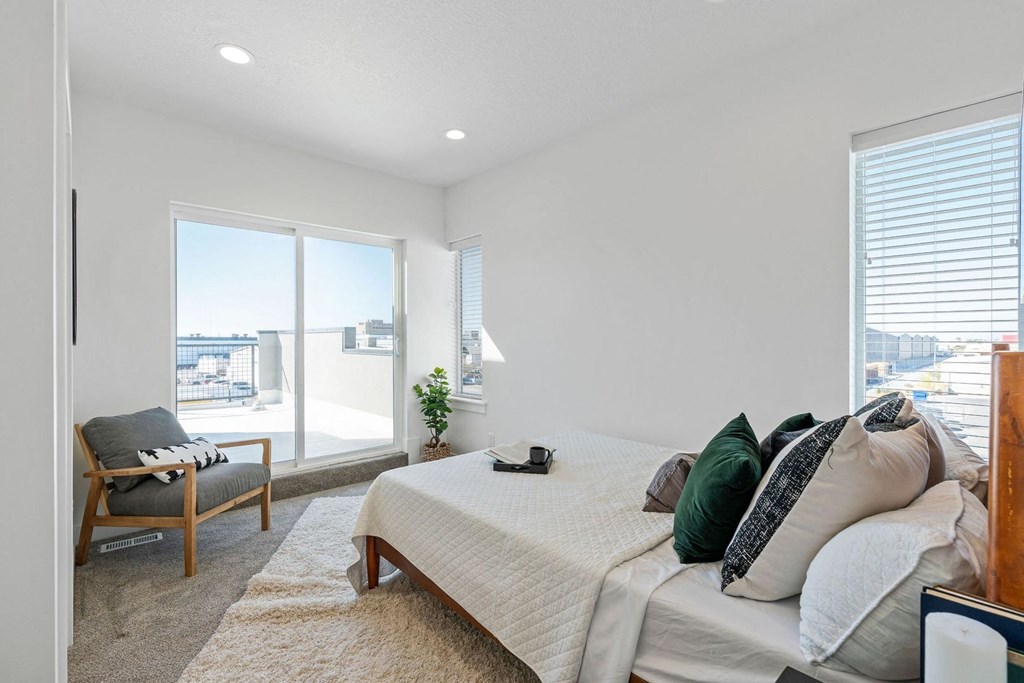 bedroom with a bed and windows