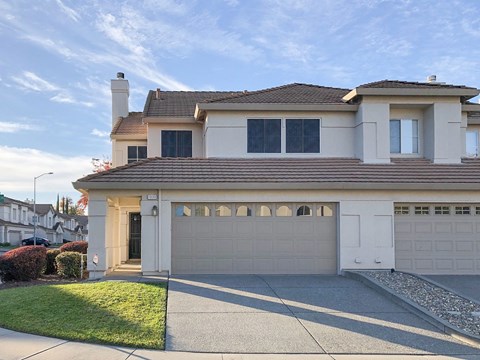 A house with a garage and a driveway.