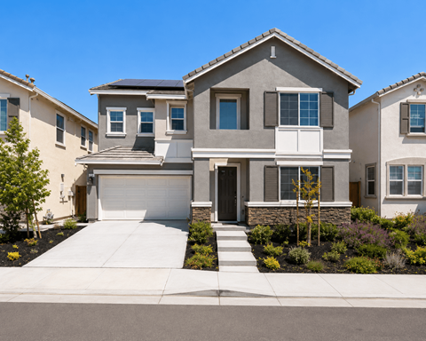 A modern two-story house with a garage and a driveway.