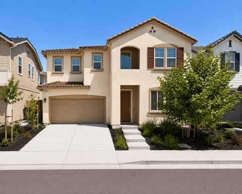 A beige house with a brown garage door and a brown window.