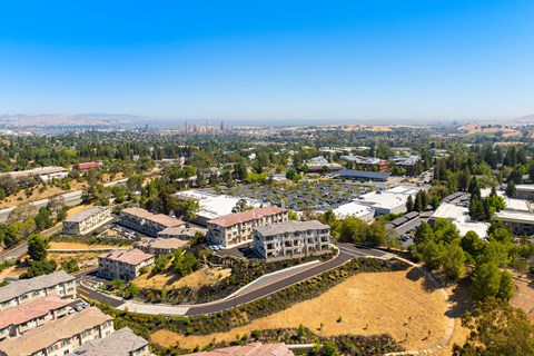 A bird's eye view of a residential area with a large building in the center.