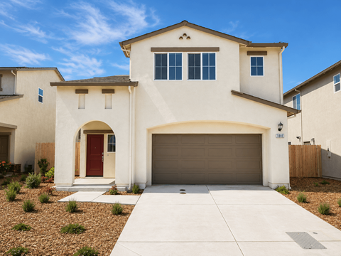 A two-story house with a red door and a garage.