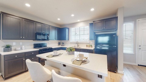 A modern kitchen with dark brown cabinets and a white island.