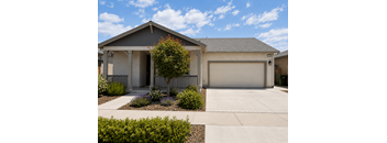 A house with a grey roof and a white garage door.