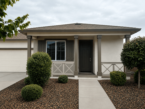 A house with a grey roof and a black door.