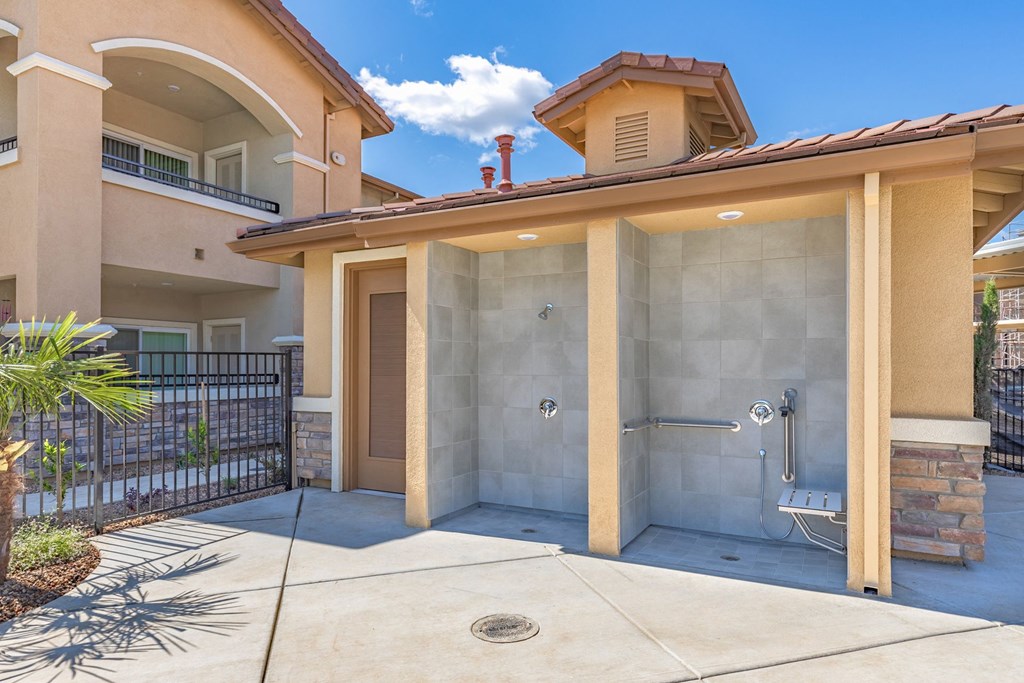 a walk in shower in front of a house with a patio a walk in shower in front of a house with a patio at Heritage Landing Apartments, Chico, CA