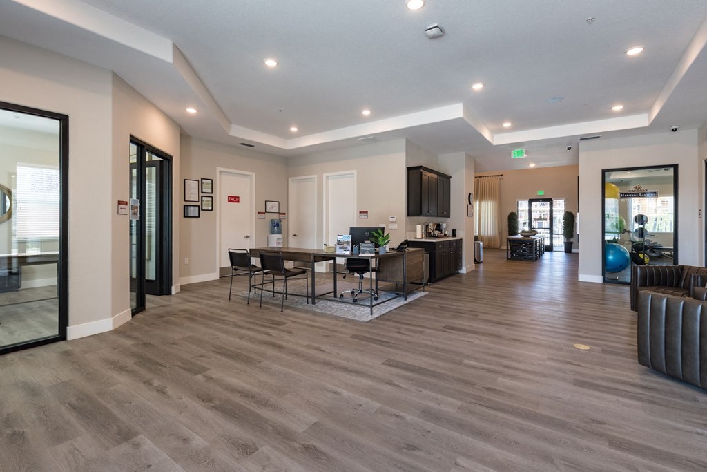 a living room and dining room with a table and chairs at Heritage Landing Apartments, Chico, California