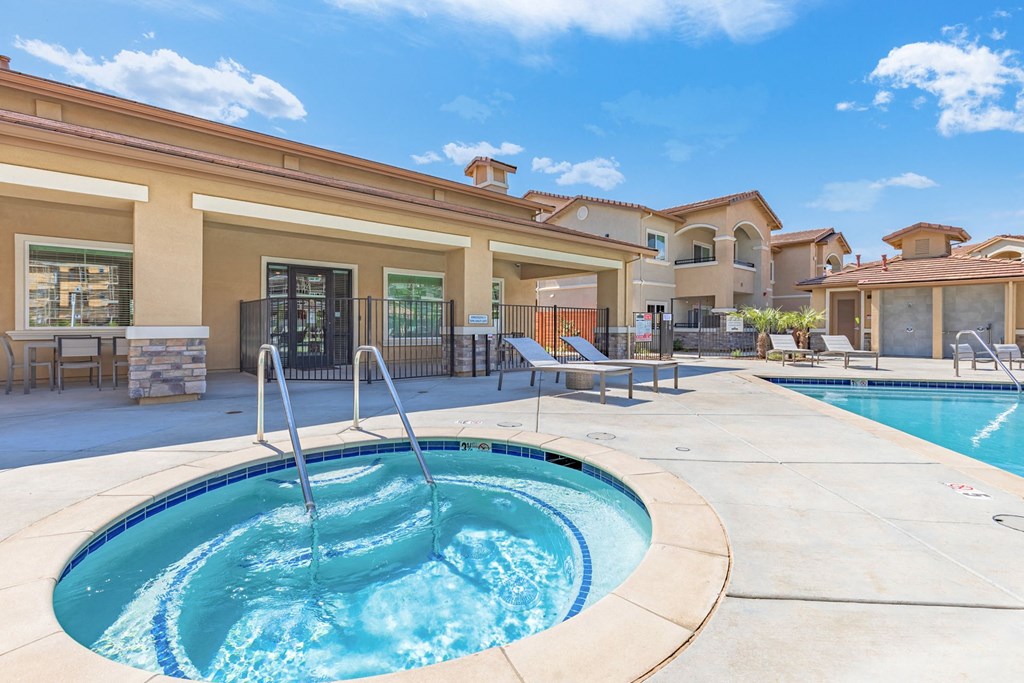 the preserve at ballantyne commons pool with a hot tub and a pool house at Heritage Landing Apartments, Chico, CA