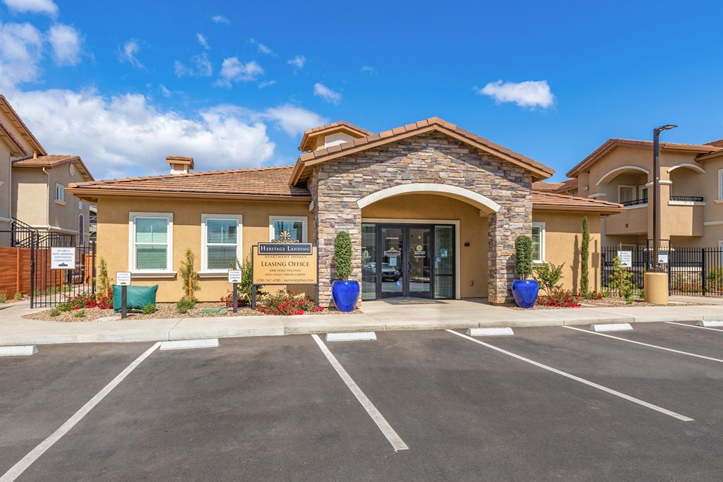 the entrance to a building with a parking lot at Heritage Landing Apartments, Chico