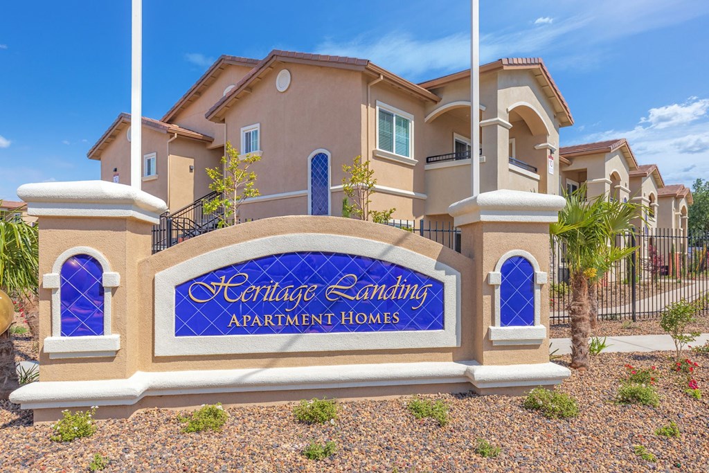 a large building with a sign in front of it at Heritage Landing Apartments, Chico, CA, 95973
