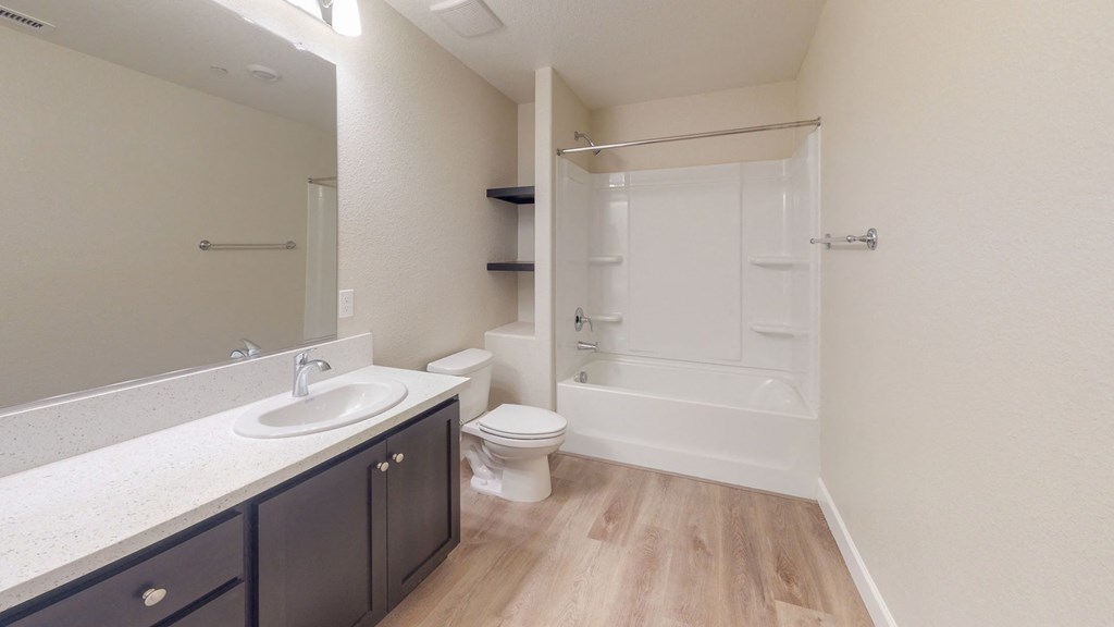 a bathroom with a sink toilet and a shower at Heritage Landing Apartments, Chico, CA, 95973